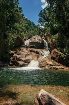 View of small waterfall lagoon in the middle of the forest at the Itatiaia Park. Fotos Stock