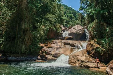 View of small waterfall lagoon in the middle of the forest at the Itatiaia Park. Fotos Stock