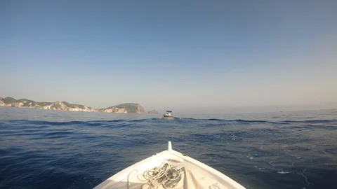 View from small white boat's bow with ropes. Sea and island. 스톡 동영상 100386365