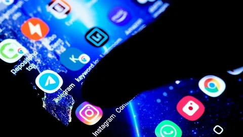 View of a smartphone and instagram app icon,social network addict,tapping Stock Footage 126588959