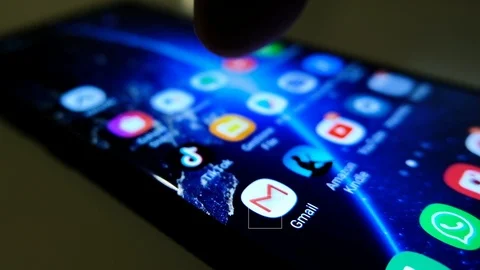 View of a smartphone,google gmail app email surfing,news,dark theme Stock Footage 126244507