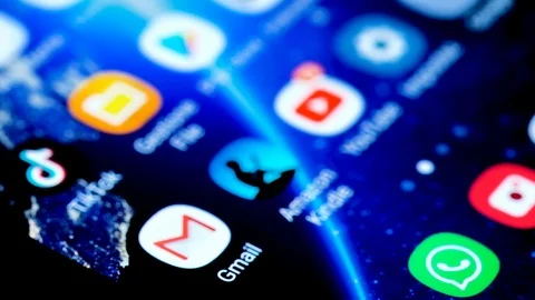 View of a smartphone,google gmail app email surfing,news,dark theme Stock Footage 126336695
