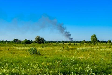 View of the smoke after missile attack on civil objects in city Kremenchuk,.. Foto stock