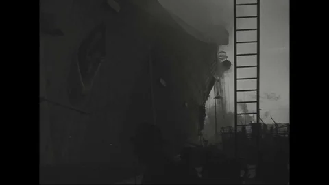 View of smoke billows from burning SS Normandie at Pier 88 - 1942 Stock Footage 101729031