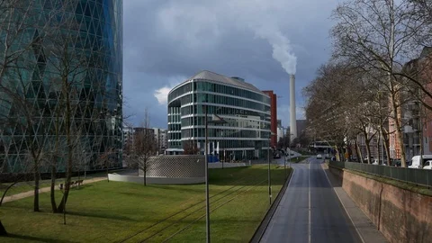 View of a smoke stack with a road in the foreground. Stock Footage 88630278