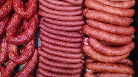 View of smoked sausages of different varieties on the counter in the store. Stock Footage 166160580