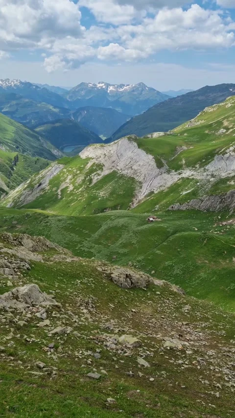  A view of the snow-capped Alps, mountains and meadows while hiking the Tour du  Video stock 284658775