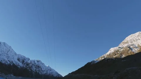 View of Snow-Capped Himalayan Peaks during Sunrise at Kedarnath, Uttarakhand Stock Footage 325905557