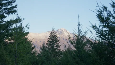 View of snow capped mountain peak in Queenstown New Zealand during autumn Stock Footage 289417281