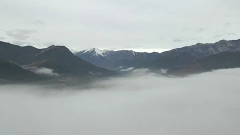 View of the snow-capped mountains above the clouds. Stock Footage 167438285