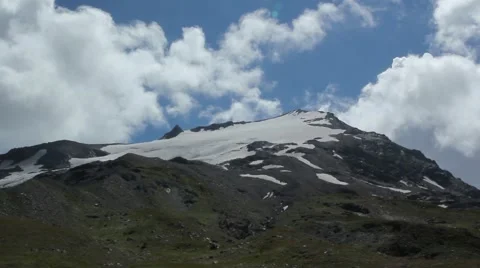 View of the snow-capped mountains and green hills Stock Footage 41493516