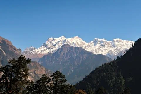 View onto the snow capped peak of Mount Manaslu from the trail leading up to  Stock Photos