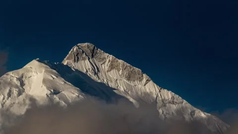 View of the snow-capped Rakaposhi mountain peak in Pakistan. Video stock 343683045