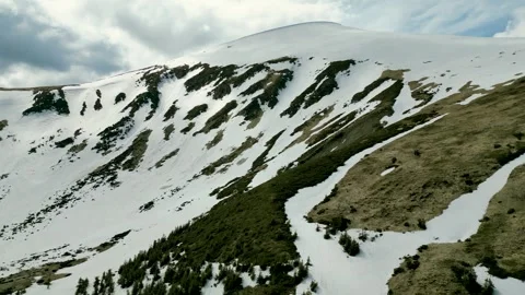A view of the snow-covered eaves and couloirs of Hoverla from the height of.. Stock Footage 242811518