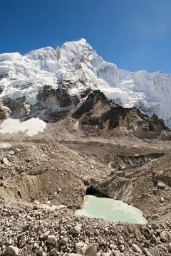 View up to the snow covered peak of Mount Nuptse, from the Khumbu Glacier wit Stock Photos