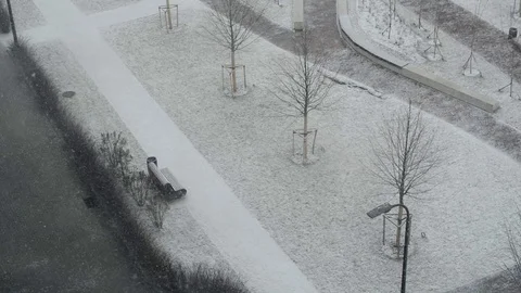 View of a snow-covered winter Park bench, snowfall is a wonderful view of the Stock Footage 127878713