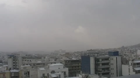 View of snow falling over Athens Greece Vidéo 47118462