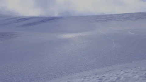 View of the snow field on the glacier on the top of the mountain with running cl Stock Footage 318412853