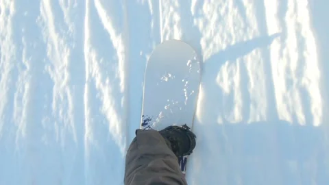 View of snowboard sliding by snowed hill Stock Footage 145353953