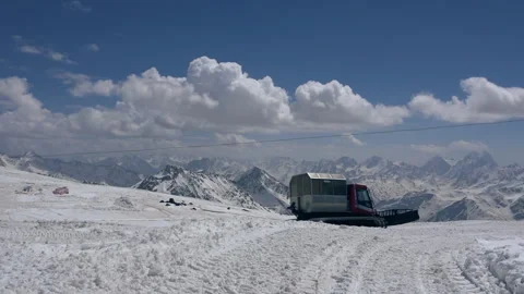 View of snowcat moving on ski slope in Caucasus Mountains in resort of Elbrus Video stock 200774323