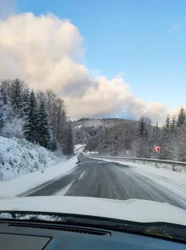 View of snowed road in mountains range car travel concept Stock Photos
