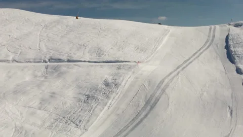 A view of a snowmobile going up to the top of the mountain, in Italy. Stock Footage 152986969