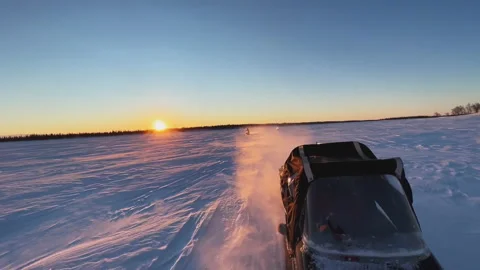 View from the snowmobile at speed. Red sun at sunset 스톡 동영상 219589371