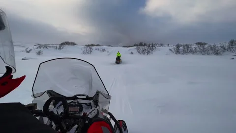 View from the snowmobile at speed. Red sun at sunset 스톡 동영상 249390606