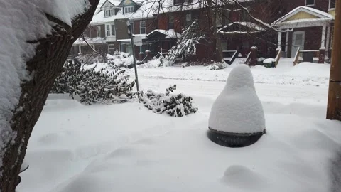 View of a snowy front yard, two-story brick private houses. Stock Footage 302563877