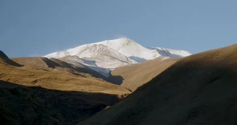 View of the snowy mountain peak Stock Footage 232137602
