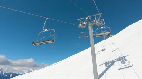View with snowy mountains and blue sky at ski resort of Les 2 Alpes, France. Video stock 202320774
