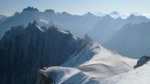 View of snowy mountains in a sunny day with light and shadow zones, during Stock Footage 205175553