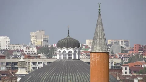 View of Sofia rooftops with synagogue dome and mosque minaret Stockbeeldmateriaal 335434673