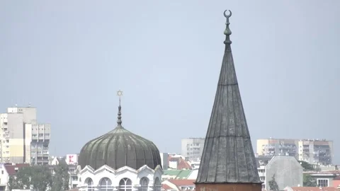 View of Sofia rooftops with synagogue dome and mosque minaret in downtown Stock Footage 335434696
