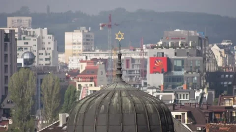 View of Sofia Synagogue dome with Star of David over city skyline during daytime Video stock 328476856