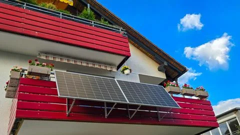 View of a solar system, fixed at an angle of 30 degrees on the red balcony of an Stock Photos