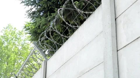 View of the solid wall with barbed wire in the countryside 動画素材 55700571