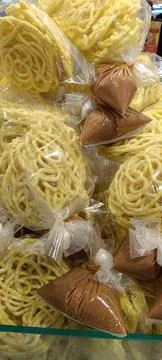 View of some side dish packaging of crackers and peanut sauce Stock Photos