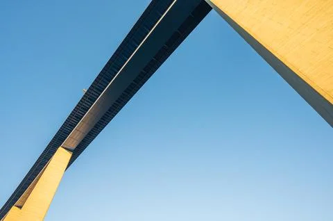 View up the span between two pillars of the 136m tall Moseltal bridge at sunrise 스톡 사진