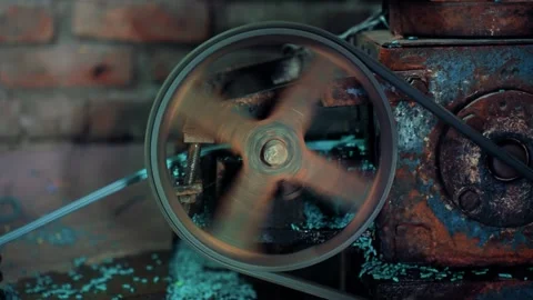 View of a spinning industrial pulley in a workshop, Bangladesh. Видео 336412094