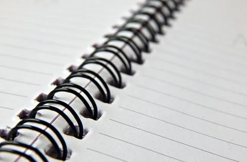 View of a spiral bound note with lined paper sheets Фото