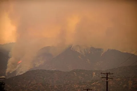 A view of the spreading flames from the Canyon Fire. Wildfire in Hills Stock Photos