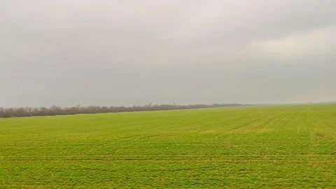 View of the spring field and rain from the car window 스톡 동영상 282480455