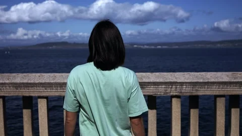 View from the sptna of a girl who walks to the ocean Stock Footage 214658053