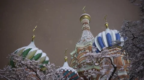 A view of the St. Basil's Cathedral through the snow-covered branches. Moscow Stock Footage 45296439
