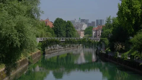 View of St James Bridge and green Ljubljanica river in Ljubljana city, Slovenia Stock Footage 157495072