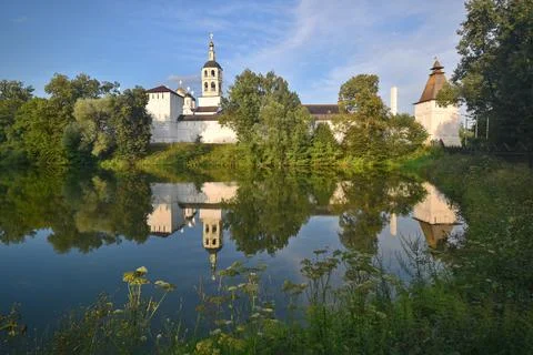 View of the St. Paphnutiev Borovsky Monastery from the ponds in summer. Stock Photos