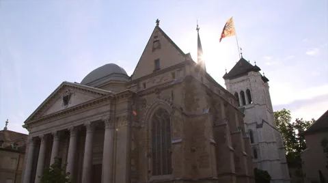 View of St. Pierre Cathedral and geneva flag Stock-Footage 68525355