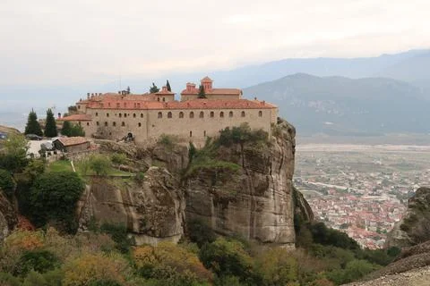View on the St. Stephen's Monastery with the town of Kalambaka in the back Stock Photos