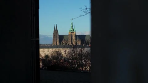 View of St. Vitus Cathedral framed by a window opening Stock Footage 264665077